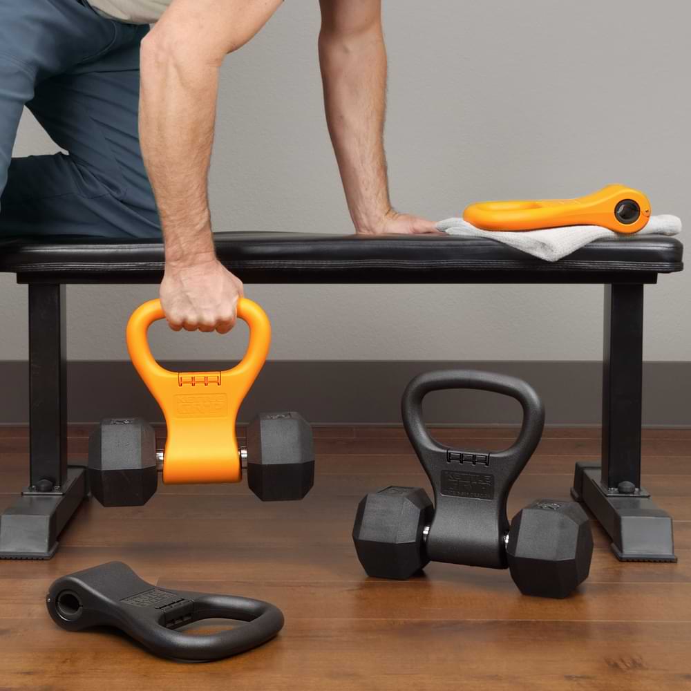 Weight bench workout with orange and black Kettle Gryps